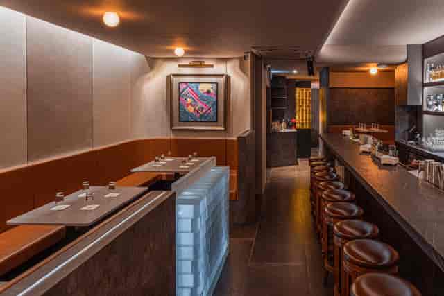 White Shades dessert bar: intimate VIP event space with warm lighting for networking and receptions.