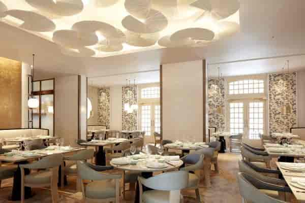 Upscale Raffles Room dining area for intimate board meetings and VIP networking events.