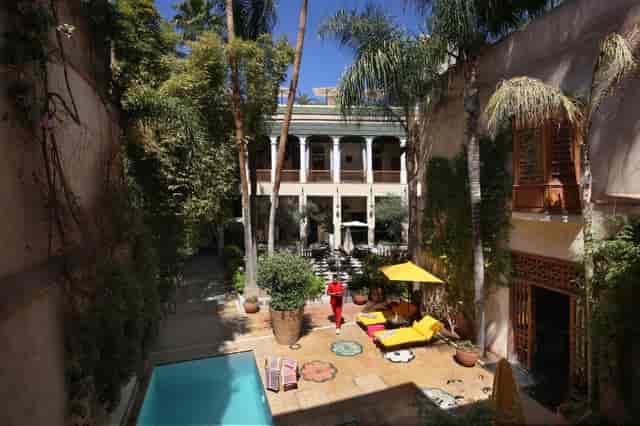 El Fenn lush courtyard poolside lounge for boutique cocktail receptions and executive networking.