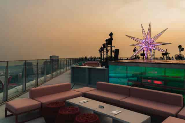 High Table rooftop venue with star art installation for evening networking and brand activations.