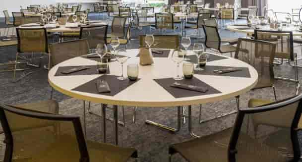 Jacobins-Celestins event space with round tables for professional corporate gala or conference.