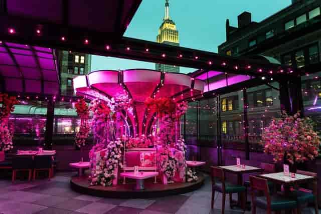 Magic Hour Rooftop lounge with floral decor, perfect for upscale NYC events and parties.
