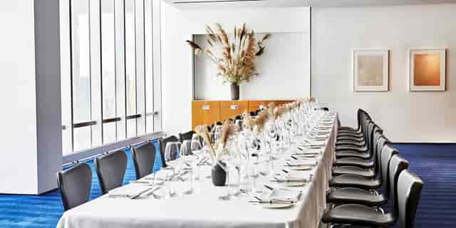 Boardroom dining setup in Private Dining Room 2 for intimate corporate VIP dinners.