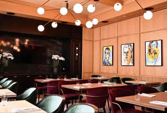 Upscale private dining room with warm lighting for executive board dinners and VIP events.