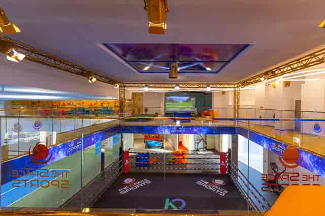 Boxing ring and simulator at The SPACE event venue for corporate team-building activities.