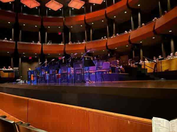 Multi-level Rose Theater opera house with stage rigging for corporate events and plenary sessions.