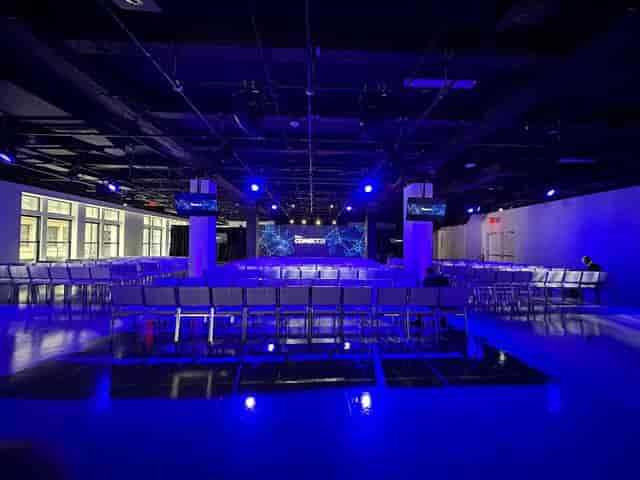 Center415 North Exhibit: Industrial-chic event space with moody theater-style lighting.