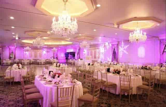 Villa Barone Manor ballroom featuring purple holiday lighting and snowflake projections for banquets.