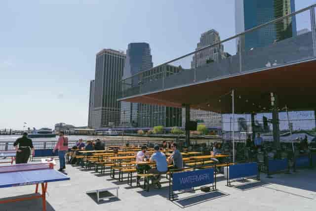Waterfront lounge with skyline view for corporate mixers and team-building events.