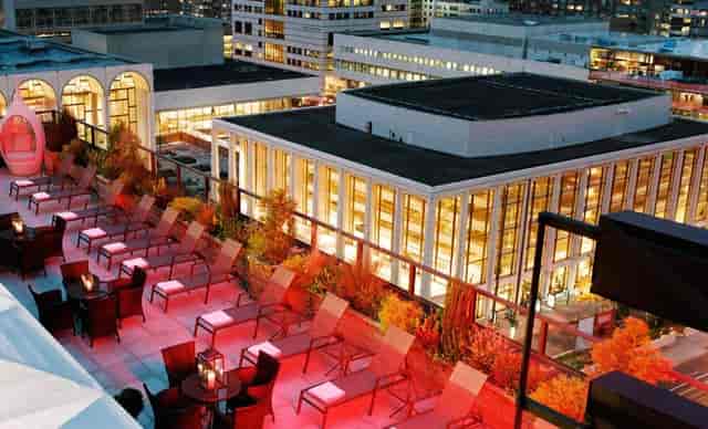 Rooftop restaurant at The Empire Hotel with atmospheric lighting for evening receptions and events.