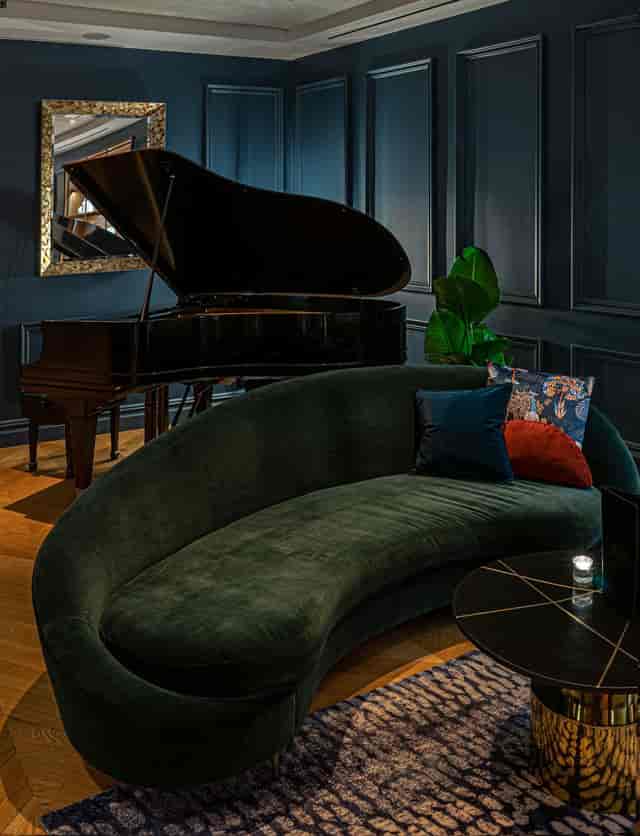 The Wallace Lounge with grand piano for upscale VIP reception and corporate networking event.