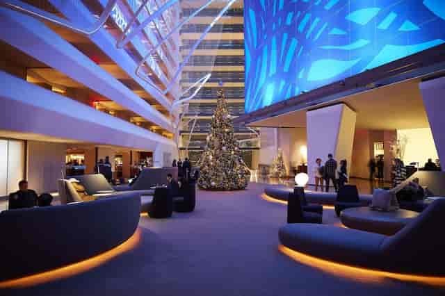 Conrad New York Downtown atrium meeting room for sophisticated networking events.