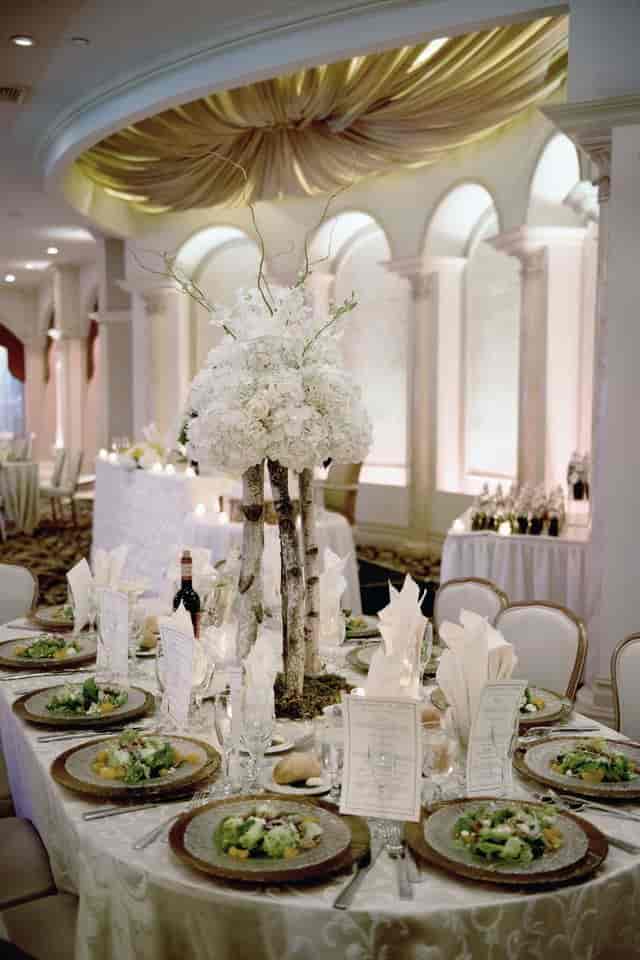 Luxury gala centerpiece with birch wood decor for upscale wedding event planning in Marina Del Rey.