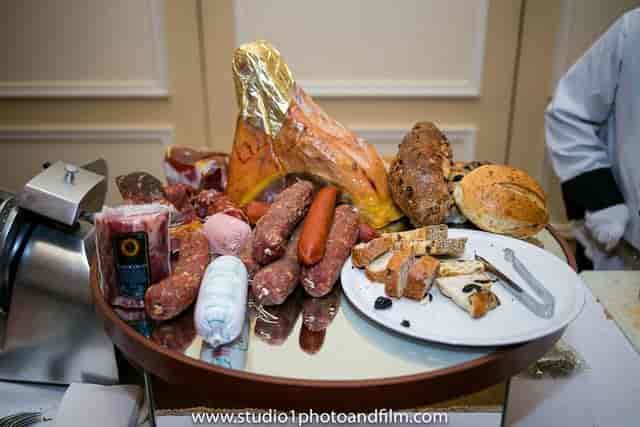 Prosciutto and charcuterie catering station for premium networking and corporate events.