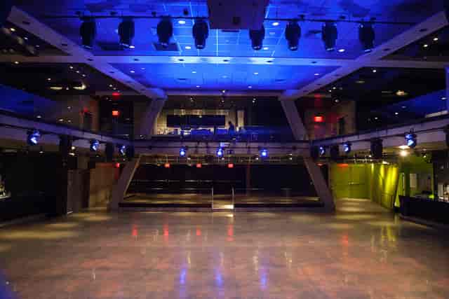 Mezzanine event space at Melrose Ballroom with stage lighting for corporate showcases and receptions.
