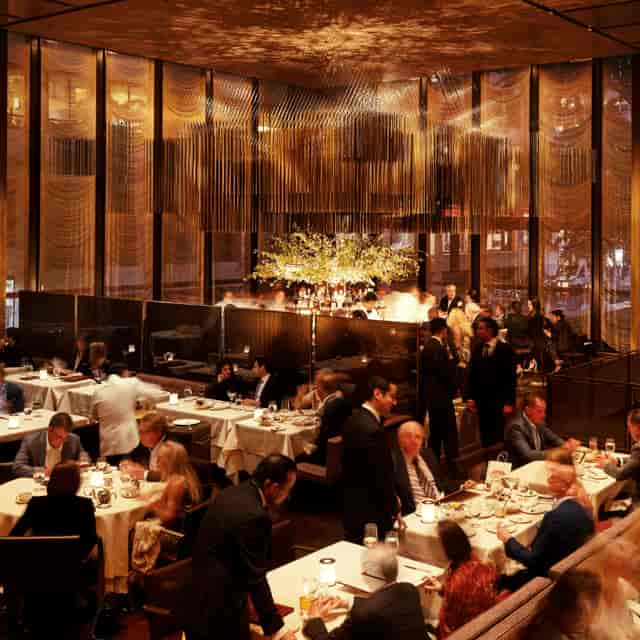 Upscale corporate networking dinner at The Gallery, elegant evening hospitality event venue.