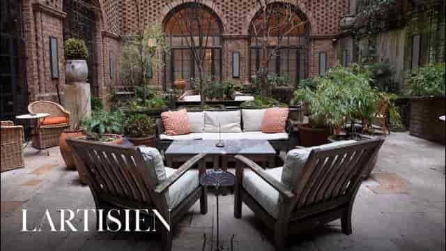 The Greenwich Hotel courtyard featuring lounge seating for luxury corporate retreats and networking.