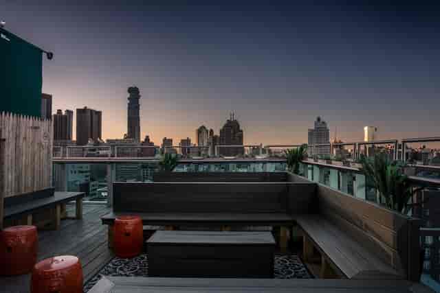 Rooftop event space in Chinatown featuring bench seating for cocktail receptions and networking.