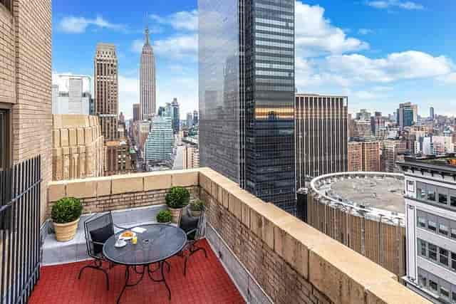 Sutton Place VIP hospitality suite with Empire State Building view for networking and meetings.