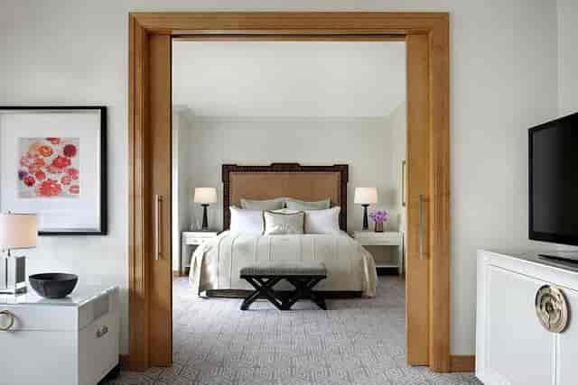 Lotte New York Palace hotel suite with private living room for VIP speaker and executive events.