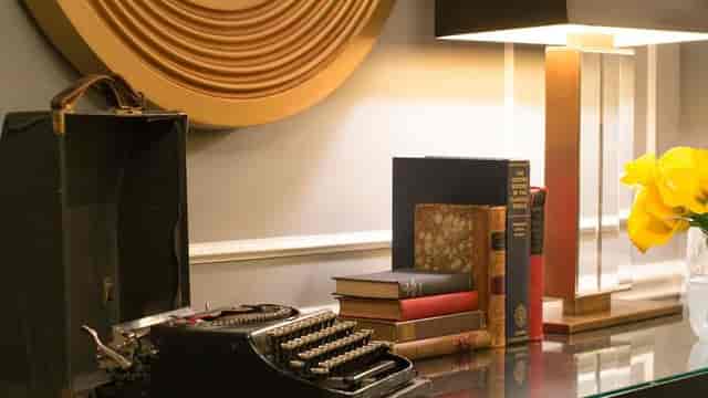 Randolph Suite boardroom with sophisticated decor, ideal for luxury business meetings and events.