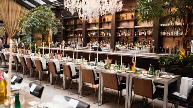 Luxury NoMo Kitchen private dining room with long-table setup for executive dinners and events.