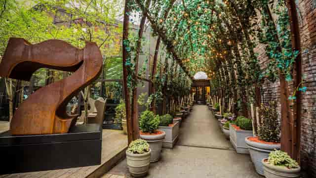 NoMo Kitchen entrance with fairy lights and greenery, perfect for weddings or corporate events.