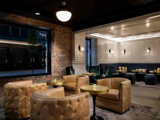 ArtHouse Hotel NYC lounge with leather seating, ideal for VIP networking and strategy sessions.