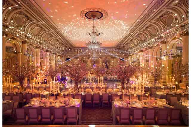 Luxury gala setup in The Plaza Terrace Room with elegant floral decor and sophisticated lighting.