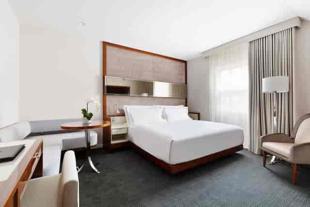 Signature Suite guest room with dedicated workspace for corporate travel and hotel room blocks.
