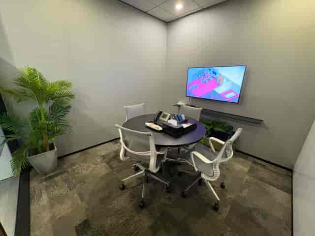 Modern huddle room at Marina Bay Financial Centre for corporate meetings and agile collaboration.