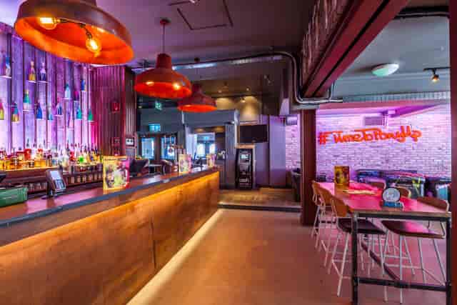Front Bar at Bar & Beyond Norwich with high-top seating for networking mixers and team happy hours.