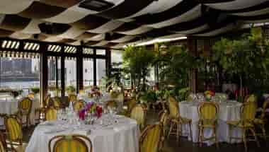 Draped ceiling event space at The River Cafe for corporate luncheons and social gatherings.