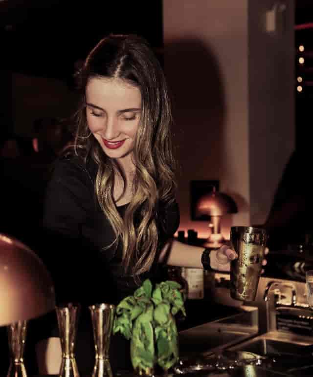 Event brand ambassador in The Saloon at Le Malt Imperiale, sophisticated corporate event host.