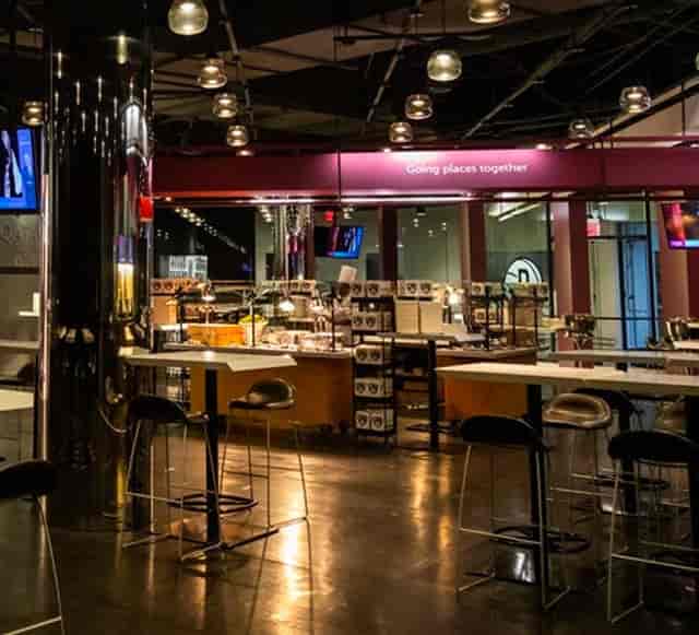 Qatar Airways Club at Barclays Center, modern event space with buffet for meetings and networking.