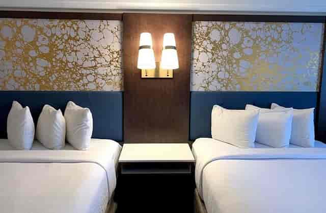 Double-queen hotel room at The Hub Murray Hill for corporate lodging and event room blocks.