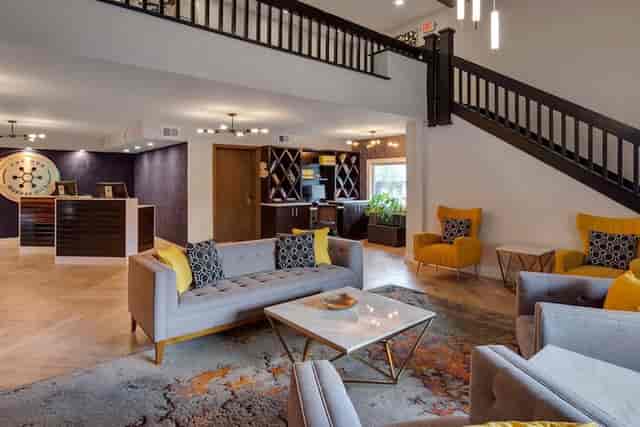 Modern meeting room with lounge seating for professional conferences and event registration.