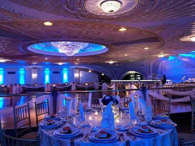 Grand Ballroom at Floral Terrace: elegant gala venue with dramatic lighting and formal seating.