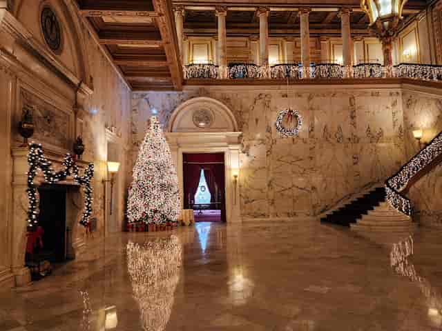 L.W. James Room marble foyer with holiday decor for luxury galas and executive receptions.