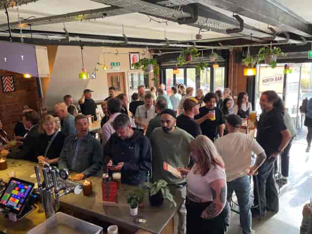 Industrial-chic bar venue at North Bar Aire Park for casual corporate networking mixers.