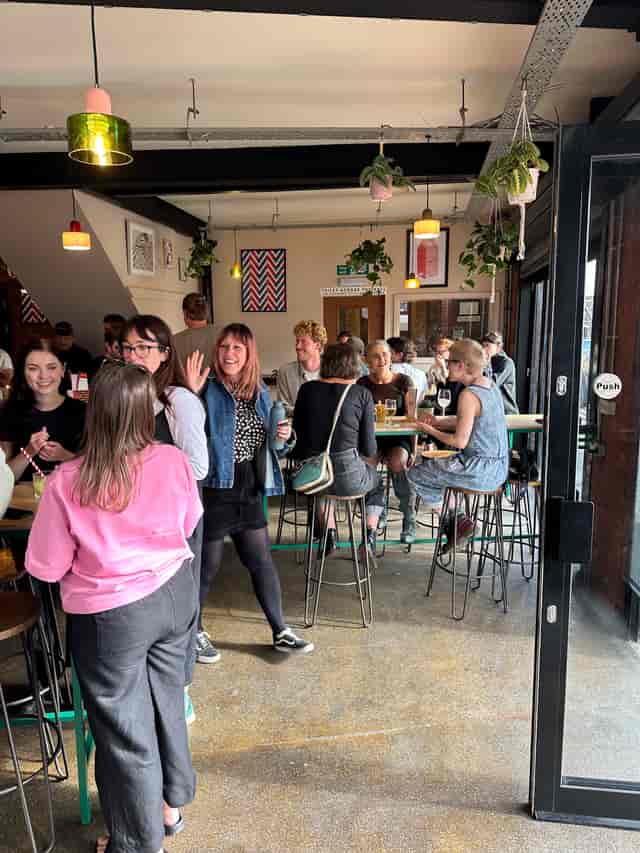 North Bar Aire Park networking mixer venue featuring a long communal table for social events.