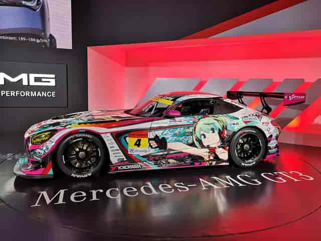 Branded vehicle on rotating stage at Makuhari Messe trade show and exhibition.