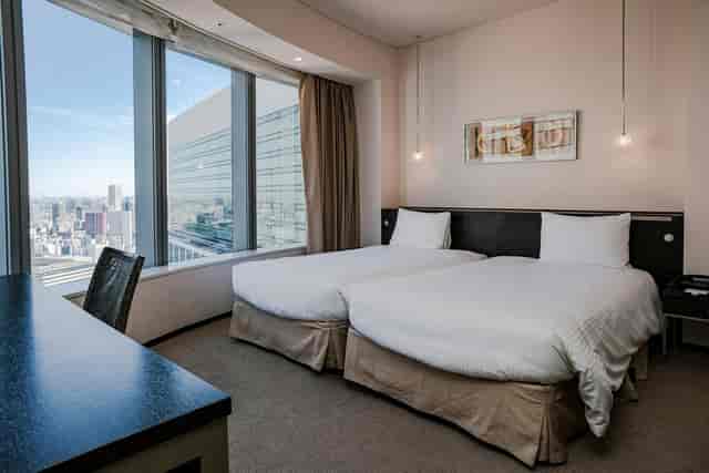 Scarlet Room at Park Hotel Tokyo: Twin-bed corporate hotel suite for business travel and conferences.