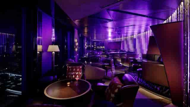 Upscale lounge with purple lighting, ideal for VIP receptions and corporate networking events.