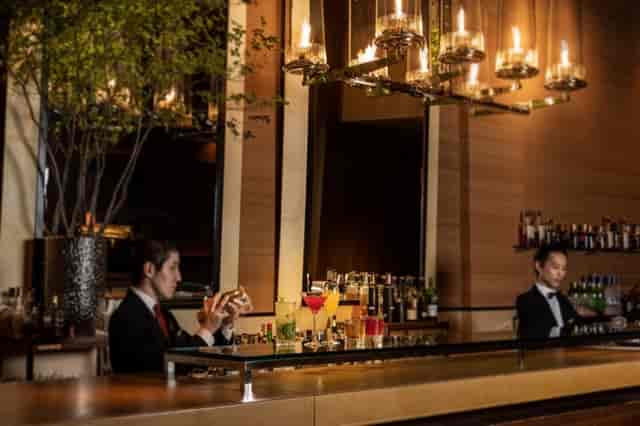 Upscale Maduro Bar with ambient lighting, perfect for VIP networking and corporate reception events.