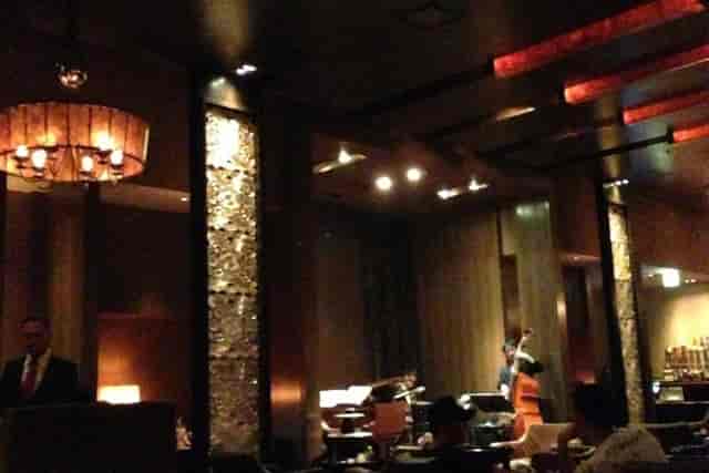 Luxury Maduro Bar lounge with warm lighting, perfect for VIP receptions and networking events.