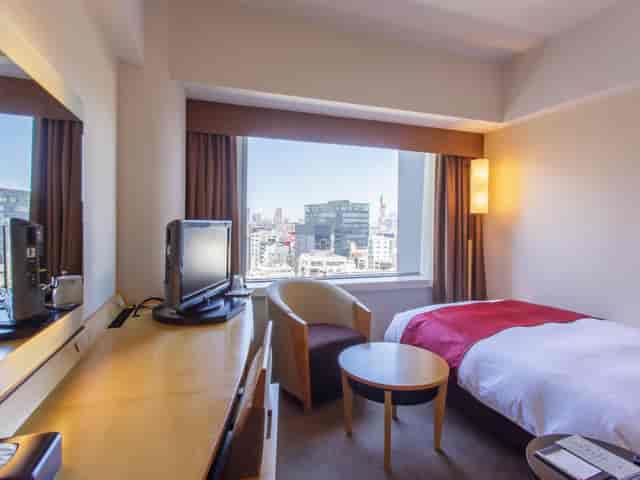 Hotel Grand Arc Hanzomon room, business traveler workspace, corporate hotel booking, urban view.