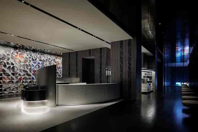Contemporary event registration area at HOTEL GROOVE SHINJUKU with sleek minimalist desk.