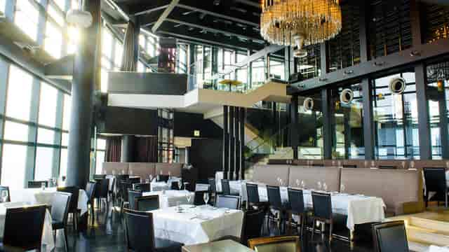 Fish Bank TOKYO upscale dining room with dramatic architecture for corporate gala and cocktail events.
