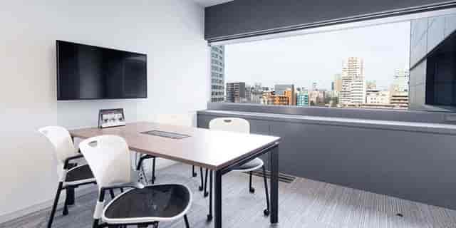 Coworking boardroom at Meguro Arco Tower with floor-to-ceiling windows for event meetings.
